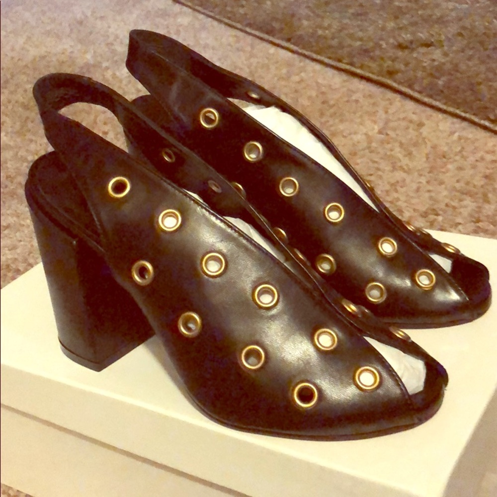 Black heels with gold circle designs